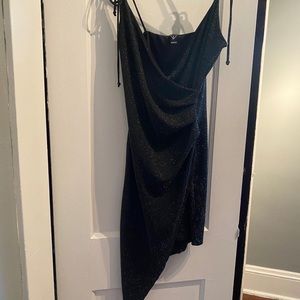 Shiny black club dress. Slit high to the thigh.